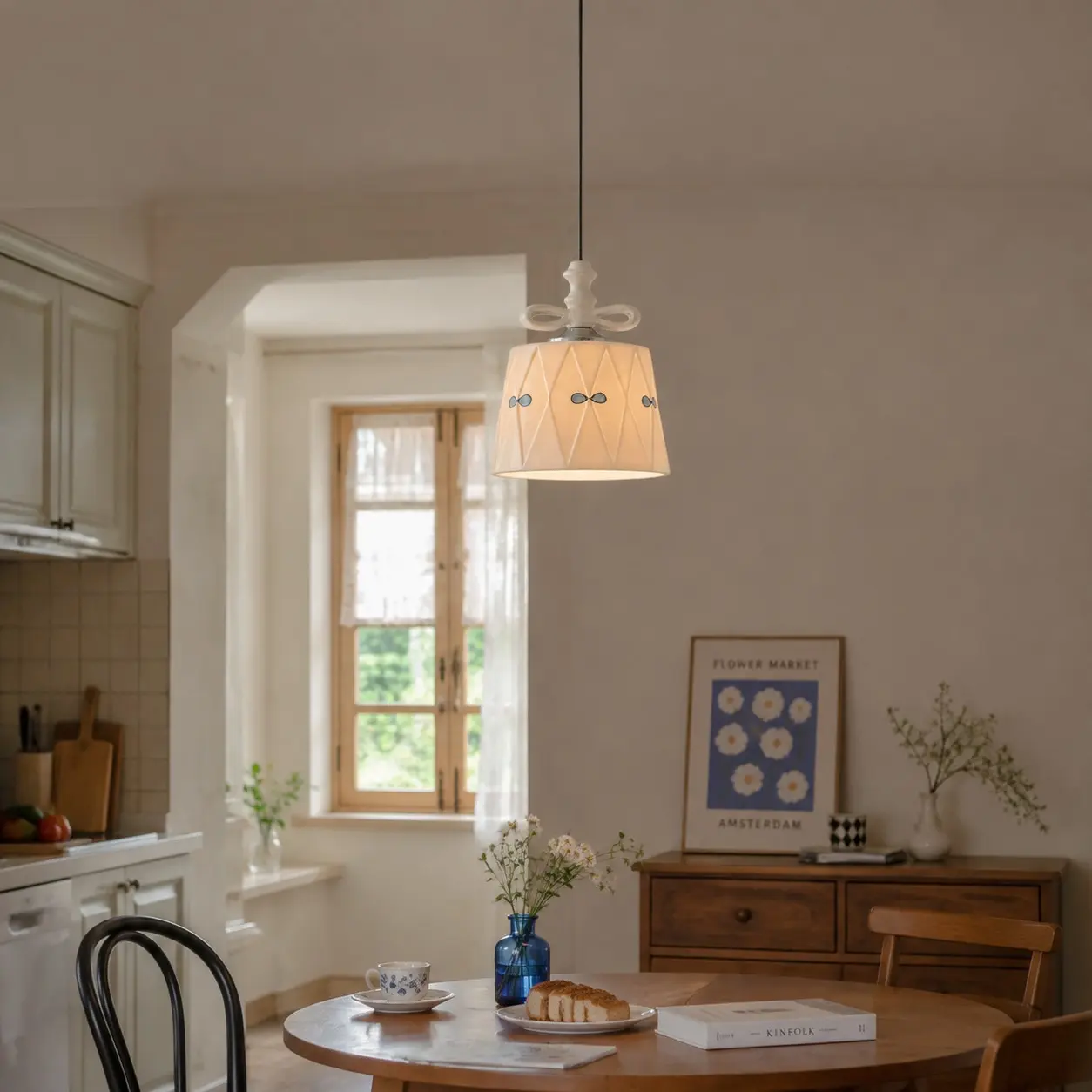 Ceramic bow pendant light in a softly lit dining space